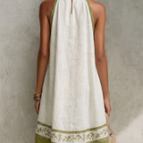 Agathe | Mini Trapeze Dress in White and Olive Green Floral Print